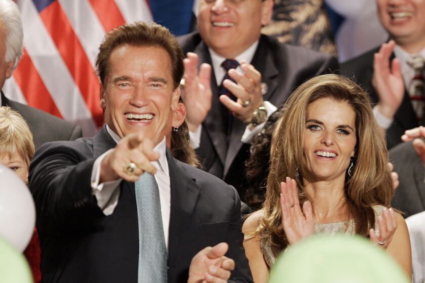 The-Gov. Arnold Schwarzenegger and then-wife Maria Shriver celebrate onstage with others