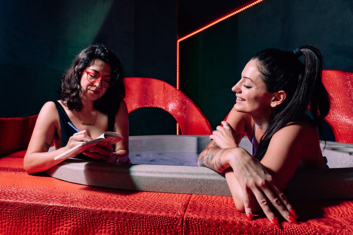 Two women in a hot tub.