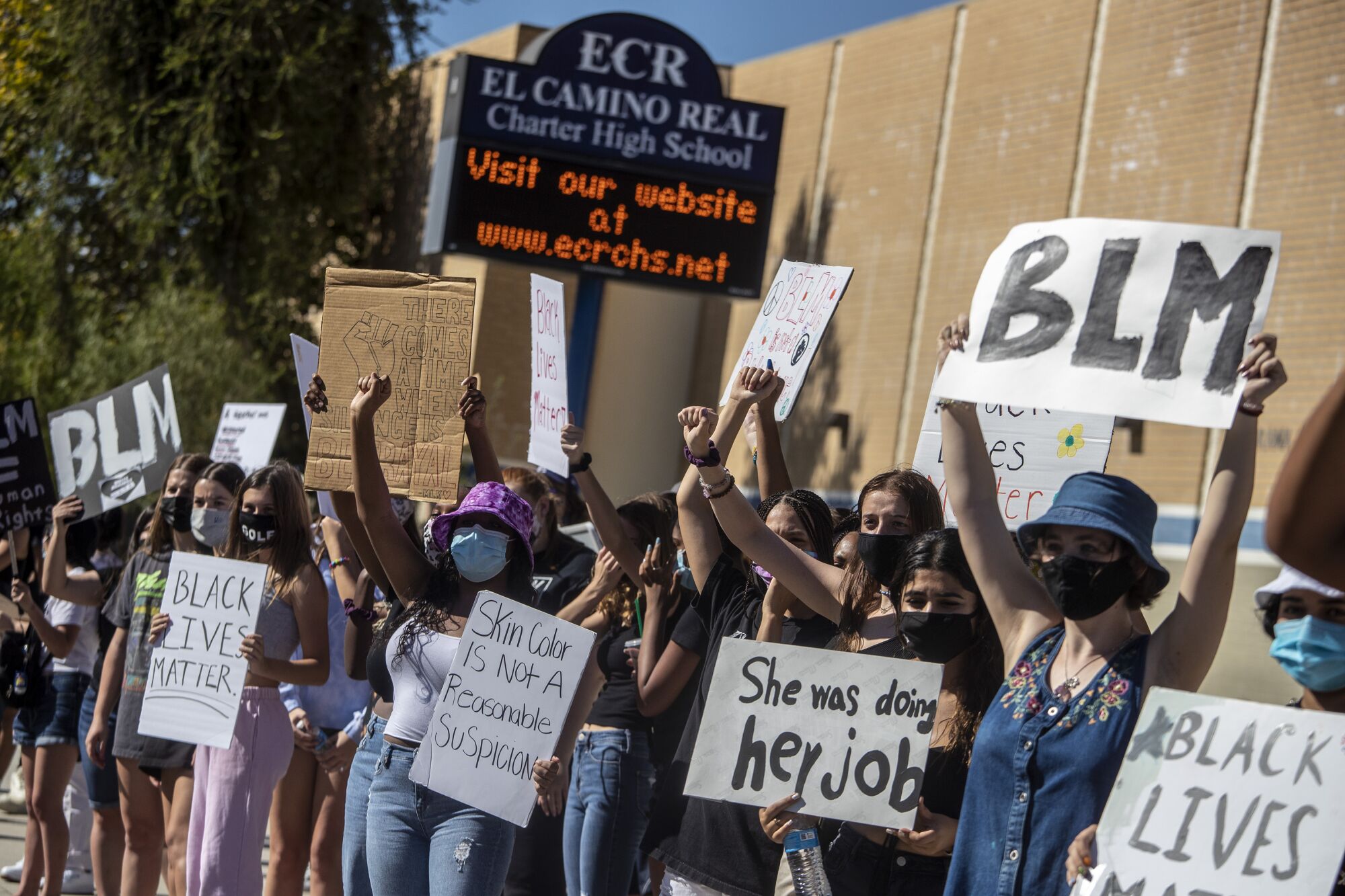 Students protest in front of El Camino Real Charter High School in support of a teacher who wore an "I can't breathe" shirt