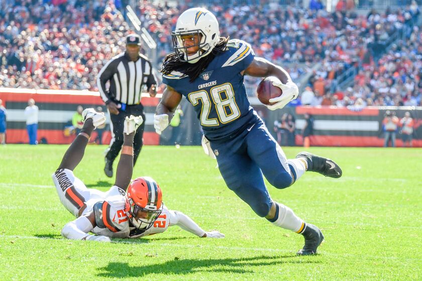 CLEVELAND, OH - OCTOBER 14: Melvin Gordon #28 runs the ball in for a touchdown against the Cleveland Browns in the third quarter of the Los Angeles Chargers at FirstEnergy Stadium on October 14, 2018 in Cleveland, Ohio. (Photo by Jason Miller/Getty Images)