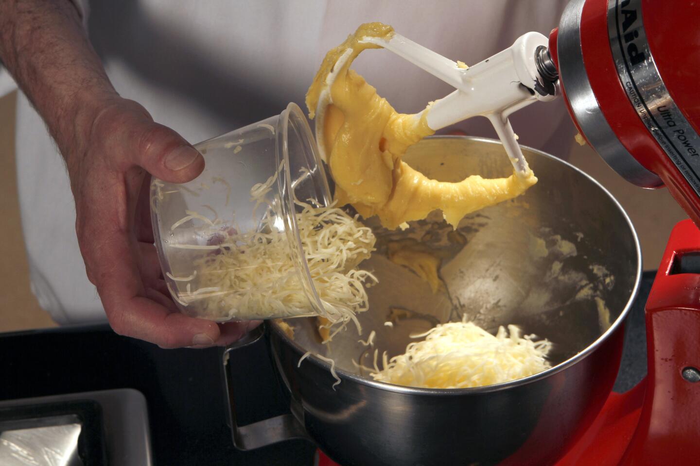 Beat the grated cheese into the mixture.
