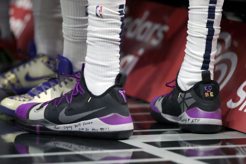 Minnesota Timberwolves forward Robert Covington wrote on his left Kobe Bryant shoe, the words, "You Legacy will forever live thru US!!! for an NBA basketball game against the Los Angeles Clippers in Los Angeles, Saturday, Feb. 1, 2020. (AP Photo/Alex Gallardo)
