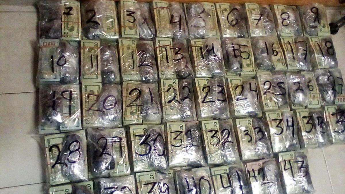 Packages of U.S. cash were found hidden in a bus crossing Mexico's Tamaulipas state this month. More than $980,000 was seized.