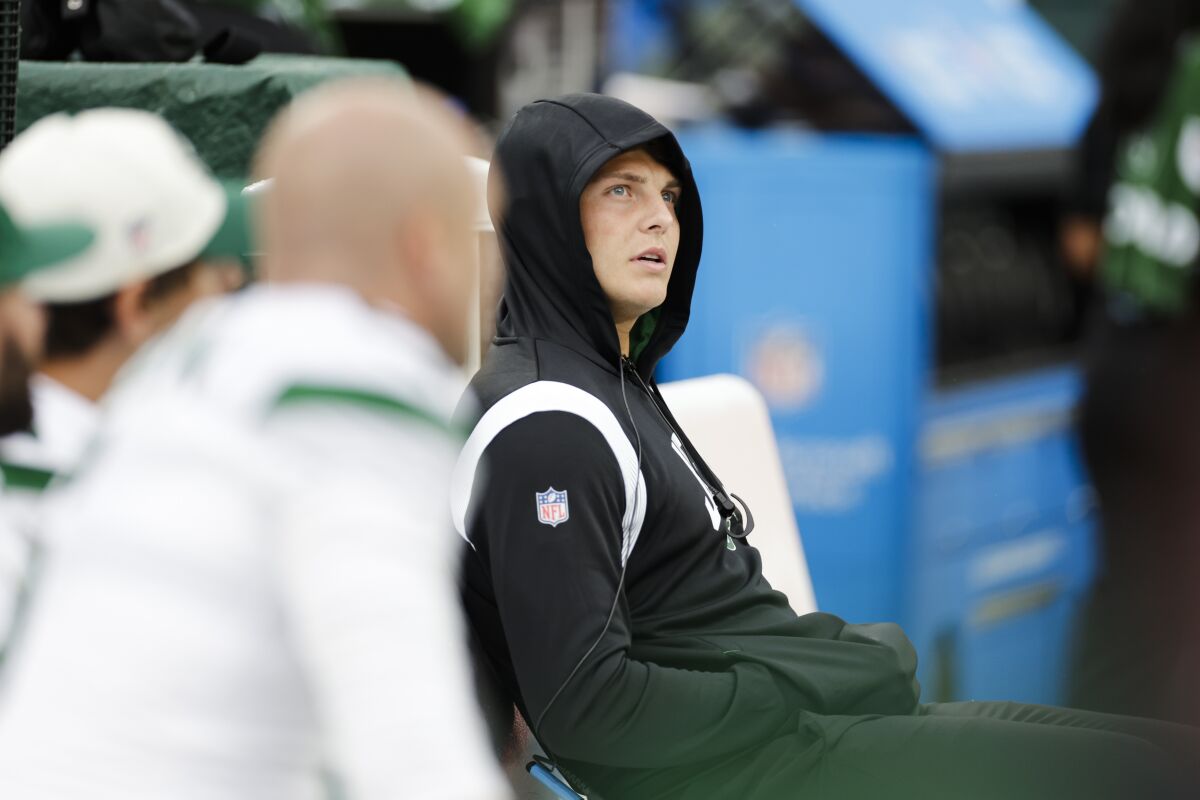 New York Jets quarterback Zach Wilson reacts during the second half of an NFL football game against the Cincinnati Bengals, Sunday, Sept. 25, 2022, in East Rutherford, N.J. (AP Photo/Adam Hunger)