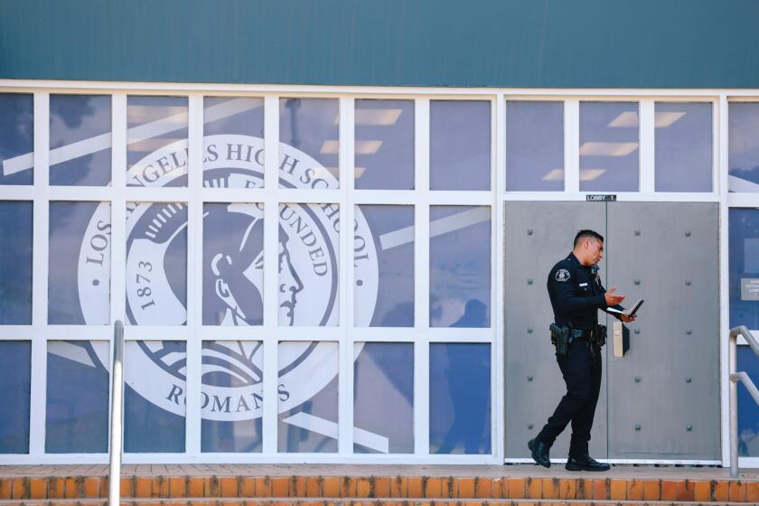 Los Angeles, CA - May 02: An officer is seen outside Los Angeles High School where two people were stabbed yesterday and three arrested today in connection on Tuesday, May 2, 2023 in Los Angeles, CA. (Dania Maxwell / Los Angeles Times).