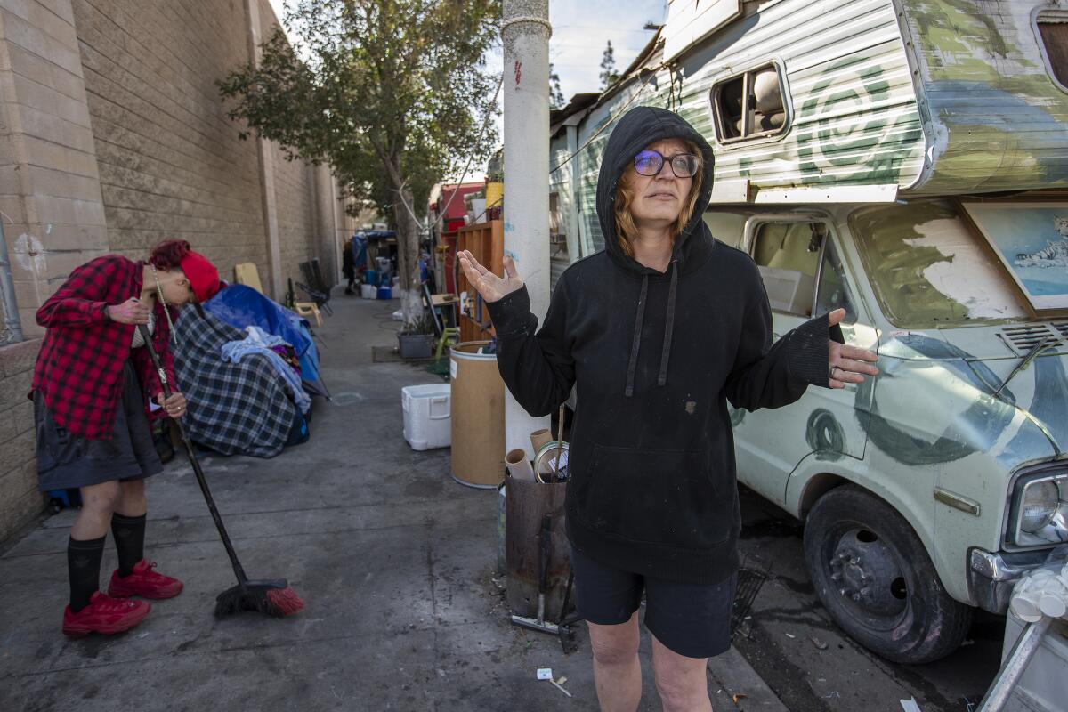 Angel Griffin, left, and India Barr next to Barr's RV at an encampment on Eaton Avenue in Chatsworth.
