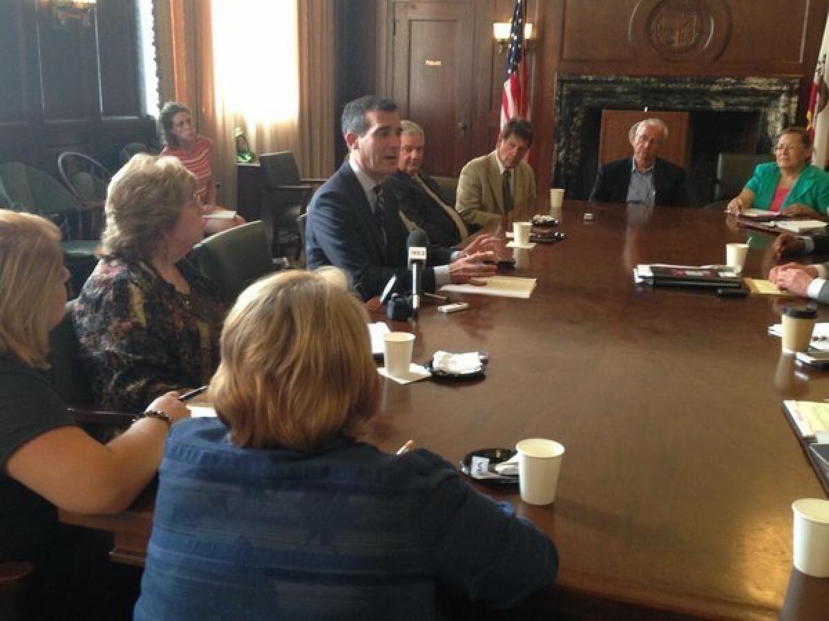 Los Angeles Mayor Eric Garcetti meets with business leaders during his first day in office.