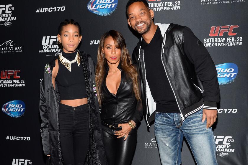 Willow Smith, left, the 13-year-old daughter of Will Smith and Jada Pinkett Smith, is the subject of controversy stirred up by a bedroom photo of her with a shirtless 20-year-old.