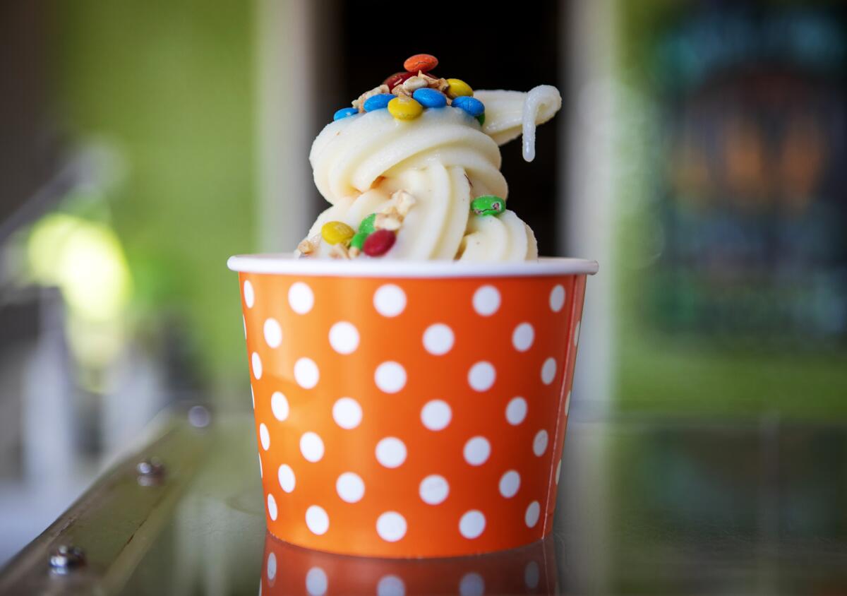 A serve-yourself swirl from Cantaloop topped with coated chocolate candy.