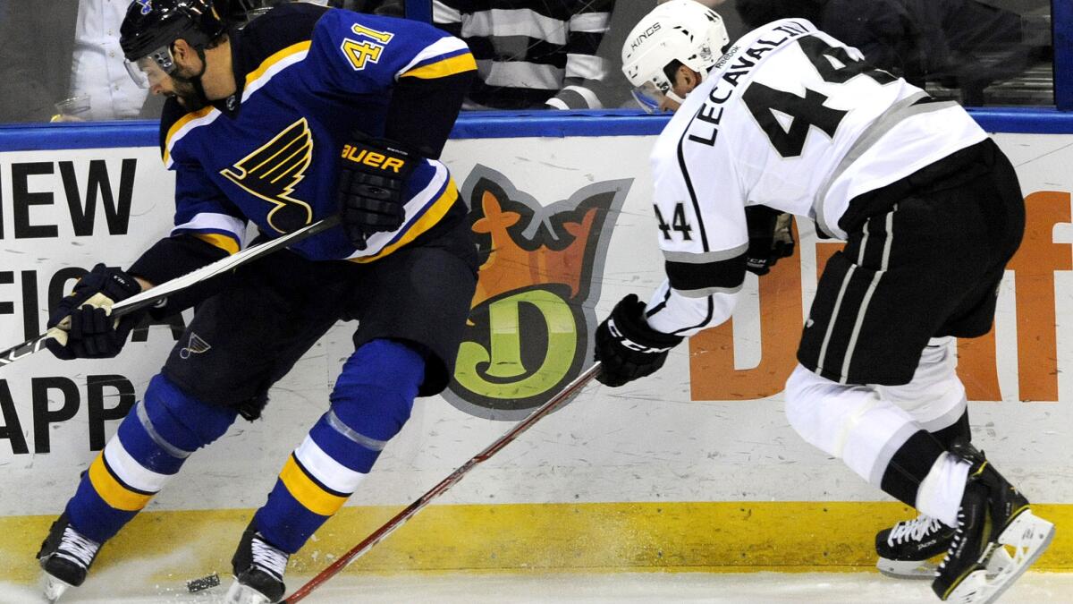 Kings center Vincent Lecavalier (44) battles Blues defenseman Robert Bortuzzo for possession of the puck during the first period Thursday night in St. Louis.