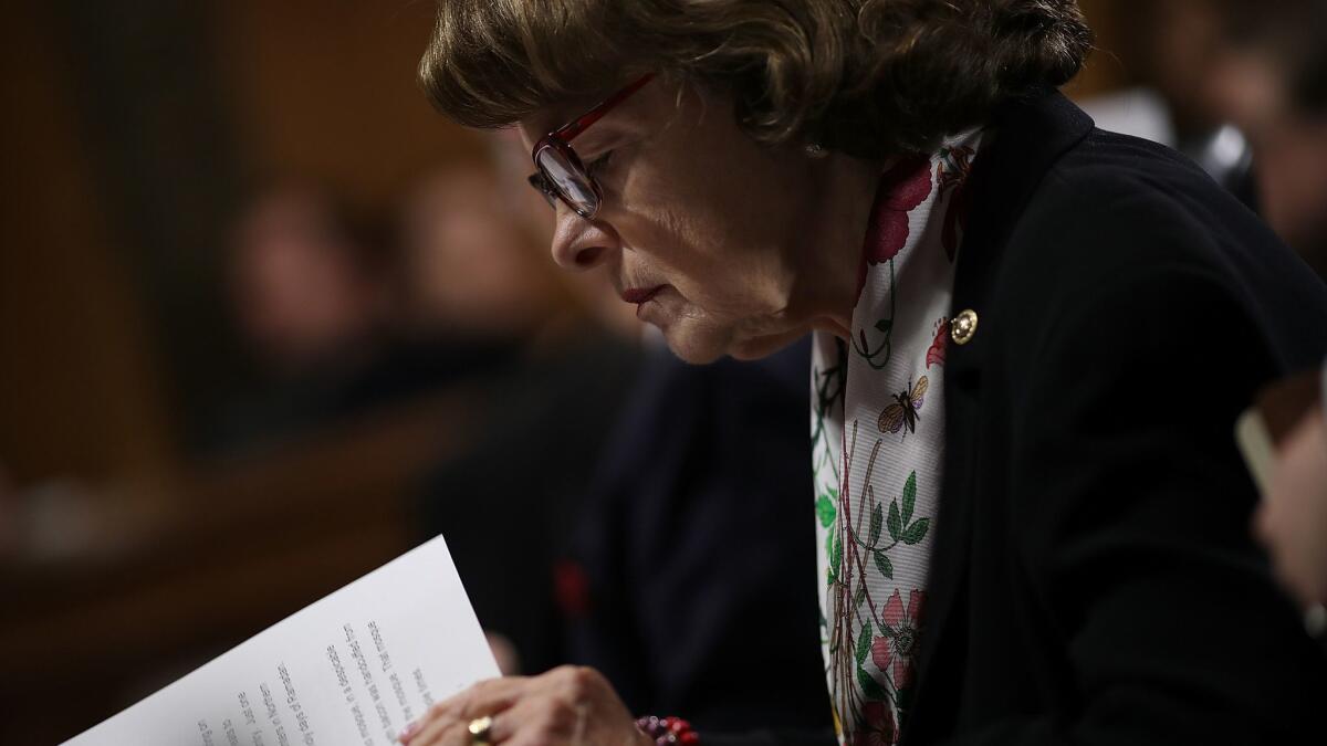 Sen. Dianne Feinstein (D-Calif.), the ranking Democrat on the Senate Judiciary Committee, studies her notes during a committee hearing.