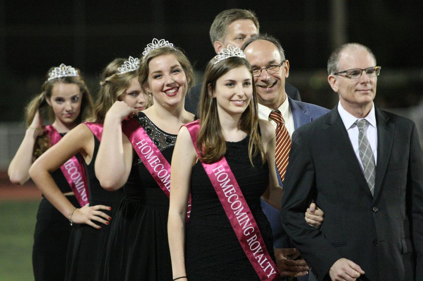 The homecoming court lines up during halftime at the La Cañada High School football game on Friday, Oct. 16, 2015.