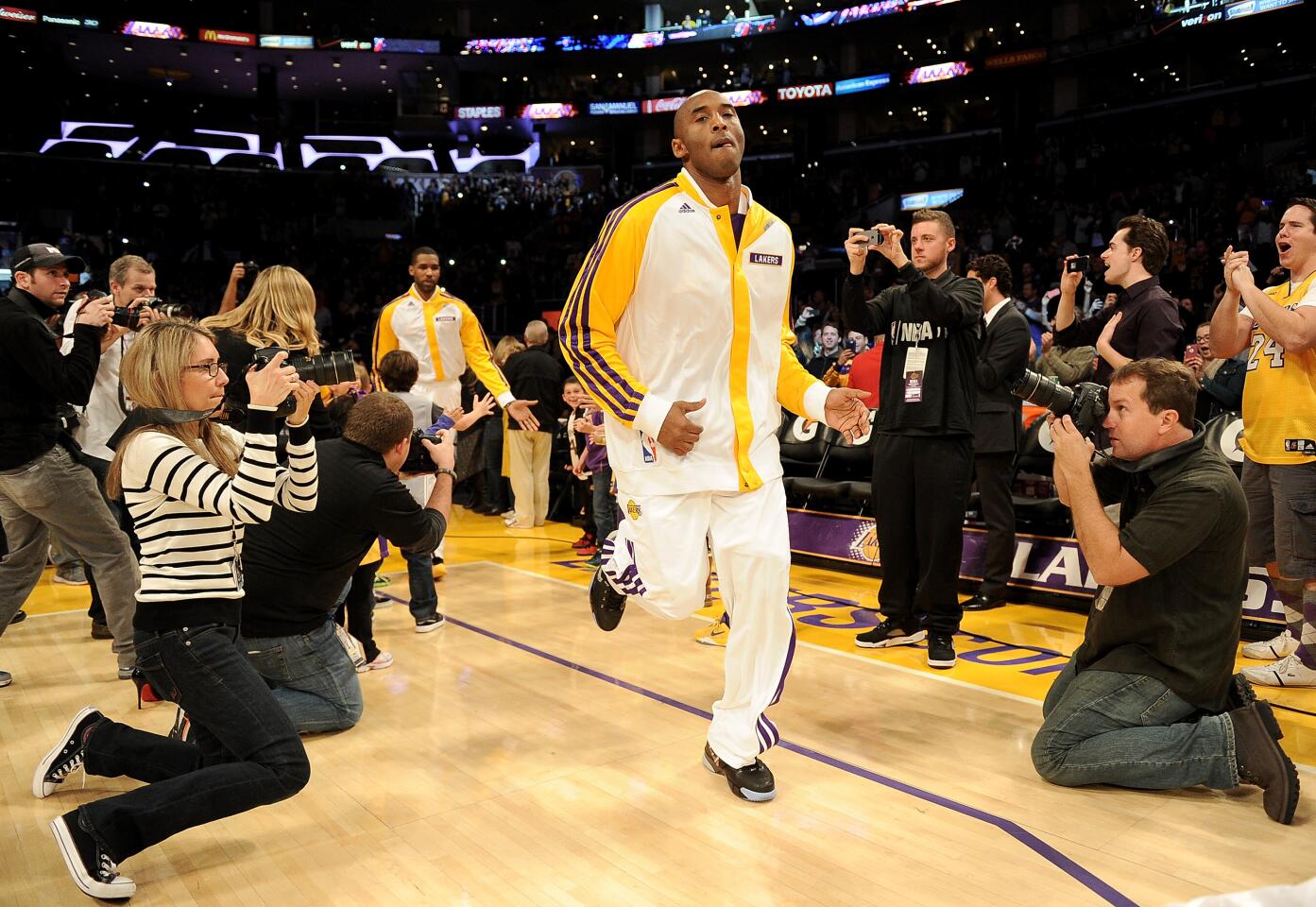 Kobe Bryant warms up during his first game after tearing his Achilles.