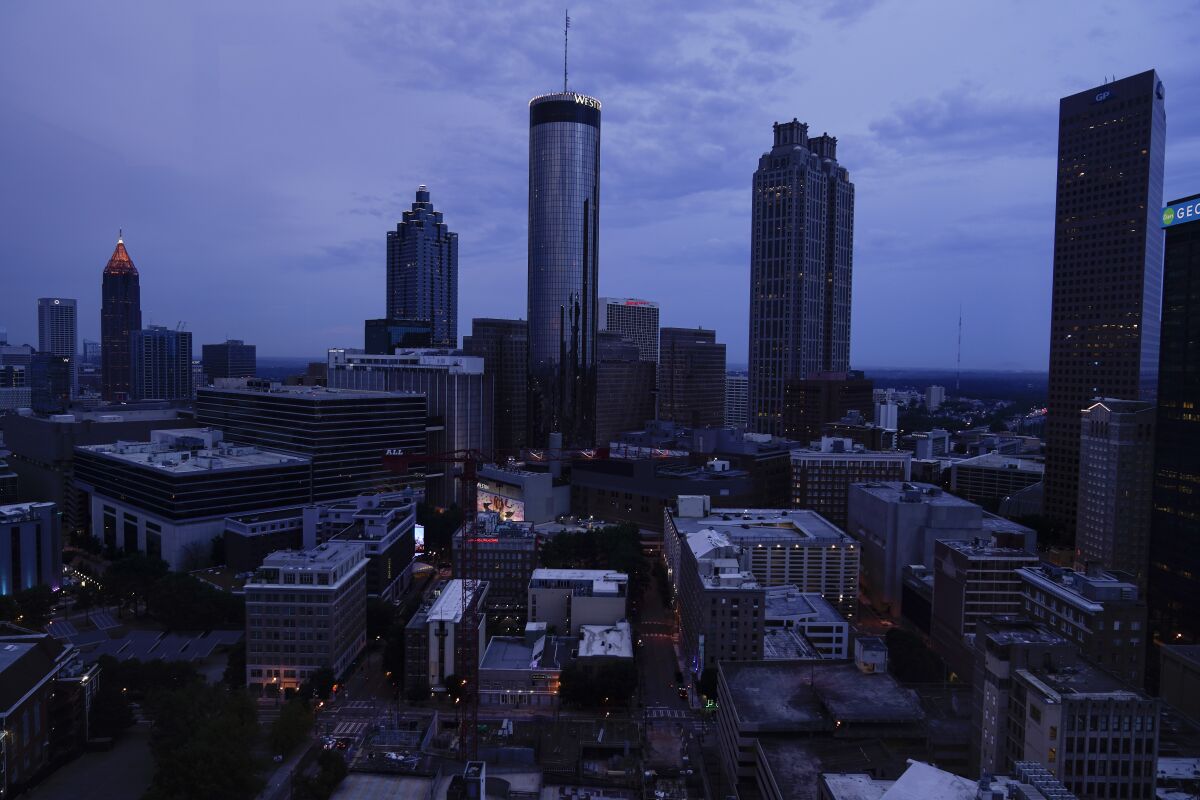 Clouds roll into downtown Atlanta on Wednesday, Aug. 11, 2021, in Atlanta. The Census Bureau has issued its most detailed portrait yet of how the U.S. has changed over the past decade. The agency on Thursday released a trove of demographic data that will used to redraw political maps across an increasingly diverse country. (AP Photo/Brynn Anderson)
