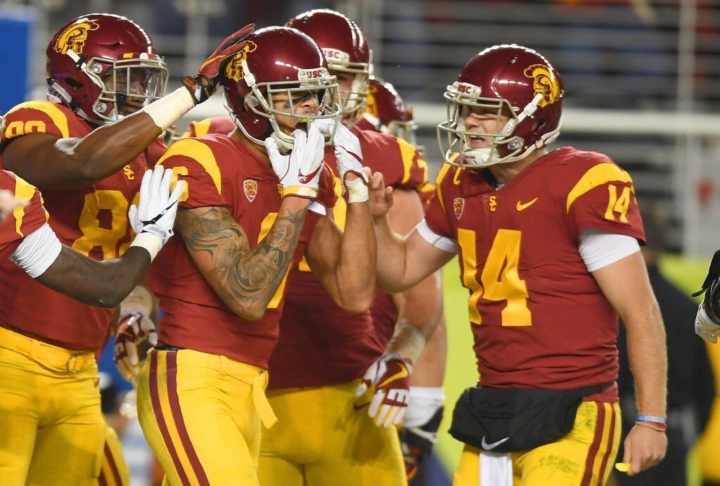 USC receiver Michael Pittman Jr., center, is congratulated by Sam Darnold (14) and Deontay Burnett (80) after his touchdown reception against Stanford.
