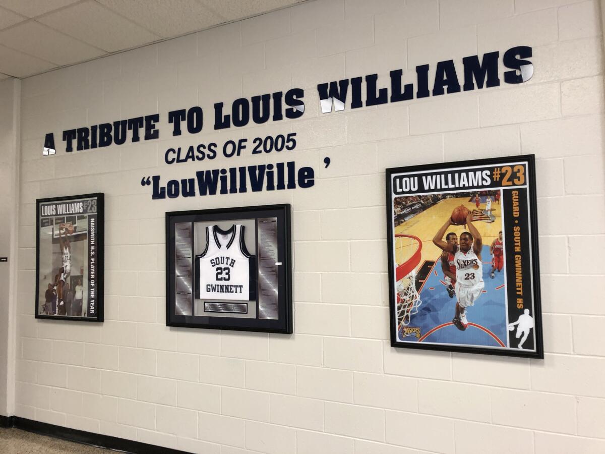 A wall inside the gym lobby at South Gwinnett High in Snellville, Ga., features a tribute to Clippers guard Lou Williams, Class of 2005.
