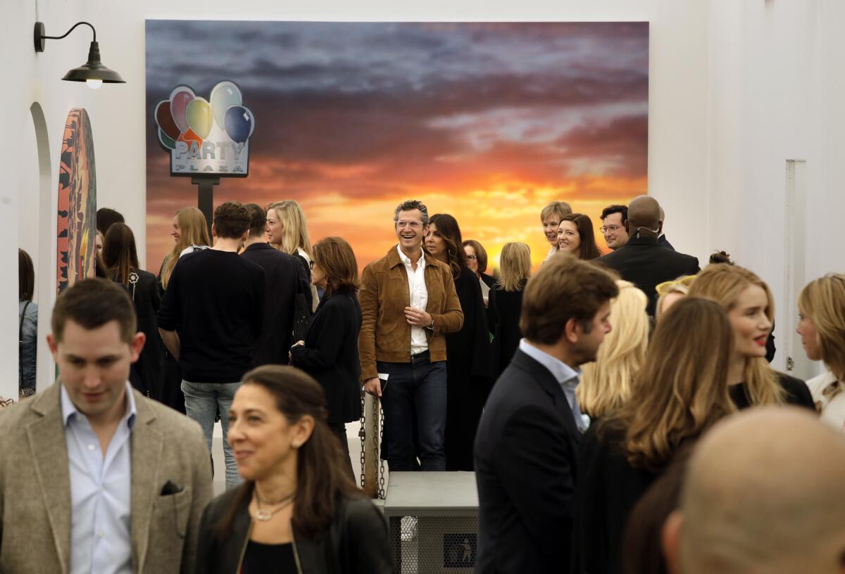 The Frieze Los Angeles crowd clusters in conversation during a previous year of the art fair.  