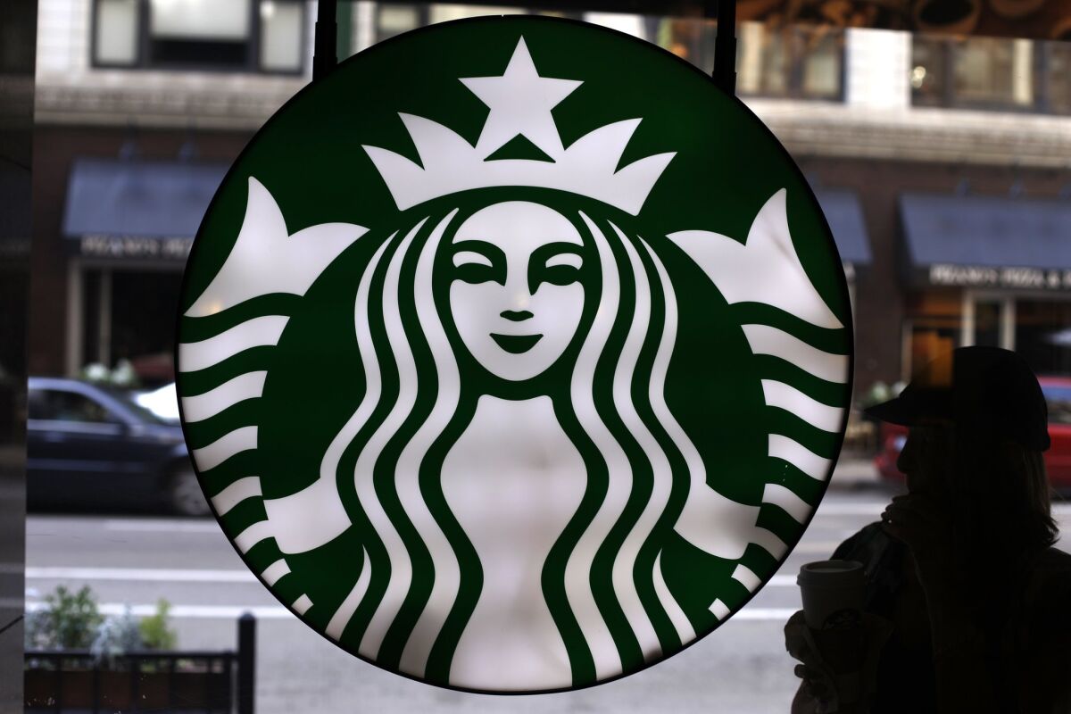 Seattle coffee chain Starbucks this week began encouraging, but not requiring, its employees to write the words "Race Together" on cups to get its customers talking about race. Above, the Starbucks logo at one of the company's coffee shops in Chicago.