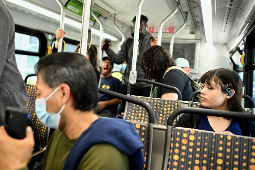 Torrance, California July 19, 2023-Tamara Cedillo rides the bus after her first job in Torrance. It takes Cedillo two hours and two buses to travel from her home in Carson to her job in Torrance. (Wally Skalij/Los Angles Times)