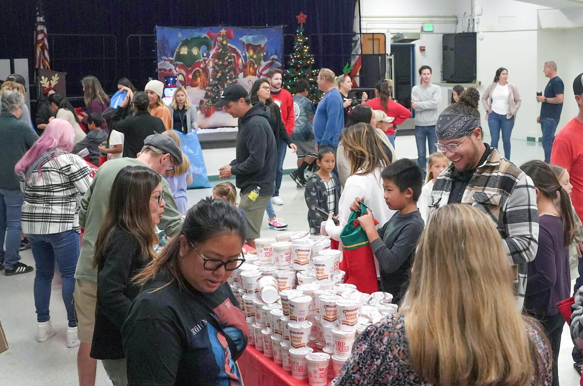 A crowd gathers at the YMCA of Orange County's "Stockings for Troops" event.