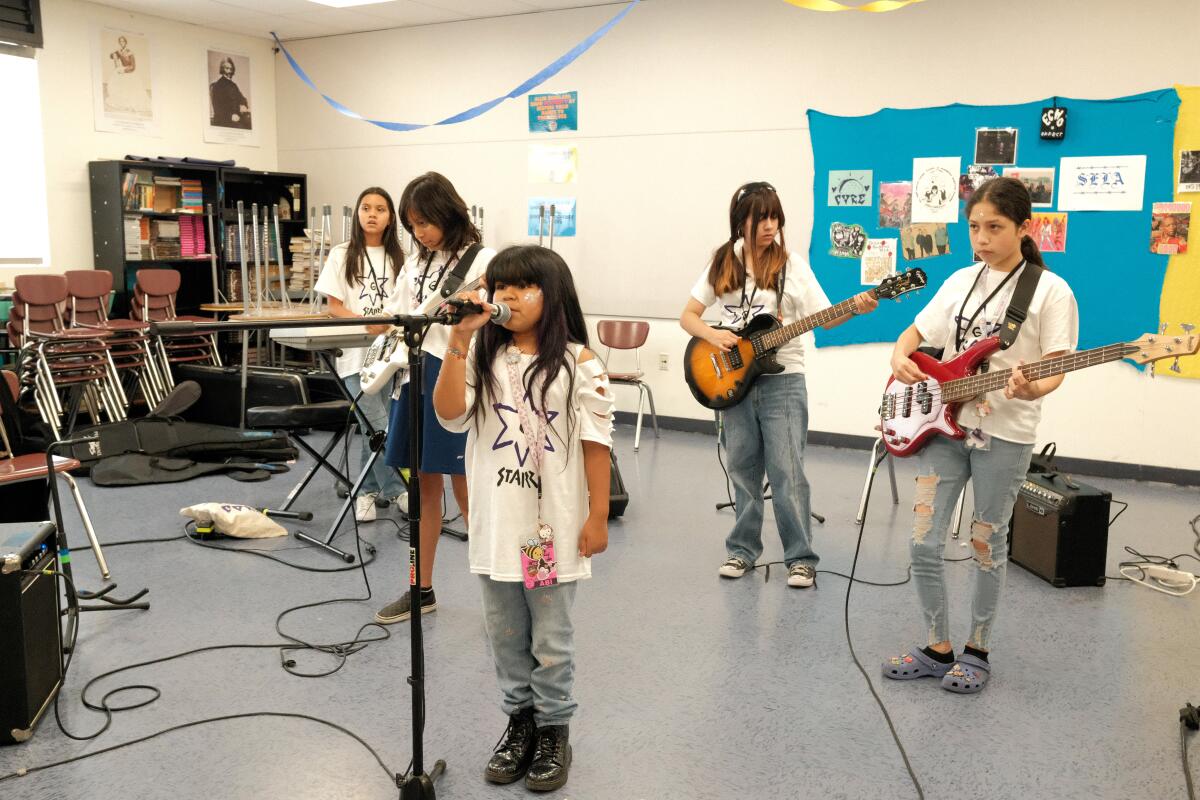 CRSELA youth campers practice rock songs