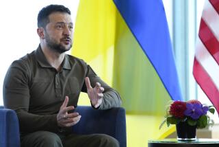 Ukrainian President Volodymyr Zelenskyy gestures during a meeting with President Joe Biden on the sidelines of the G7 Summit in Hiroshima, Japan, Sunday, May 21, 2023. (AP Photo/Susan Walsh)