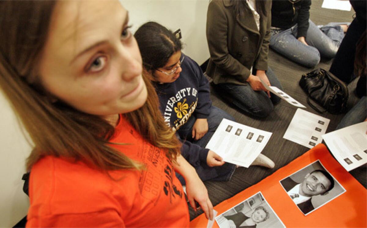 DEMOCRAT CLUB: Sonja Weaver-Madsen prepares an informational political poster during a meeting of the Bruin Democrats club. Illinois Sen. Barack Obama won a mock campus election among Democrats with 54% of 1,387 votes cast.