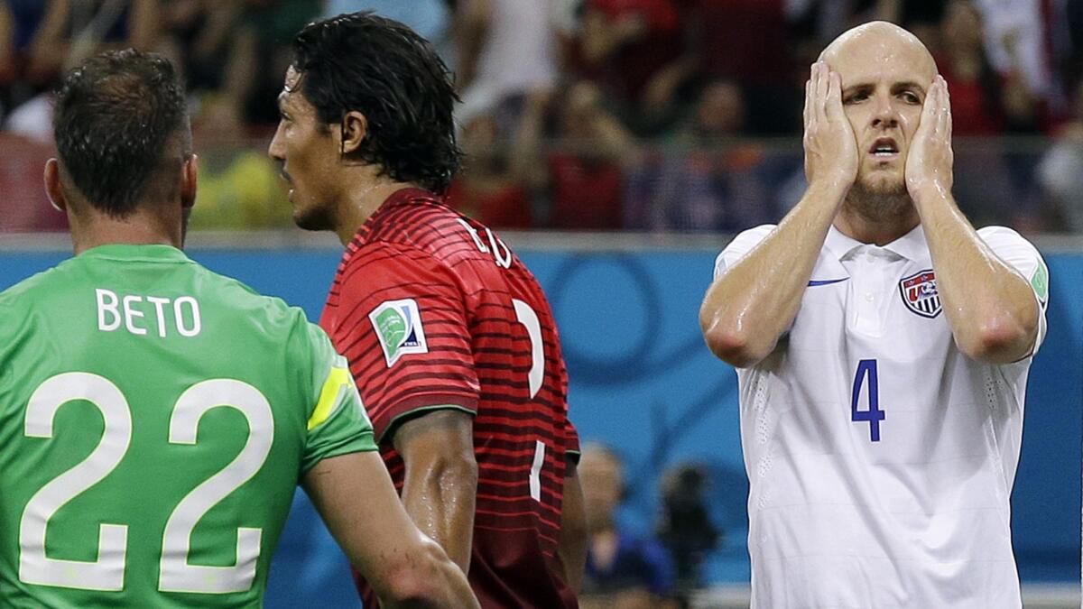 U.S. midfielder Michael Bradley, right, reacts after his shot was blocked by Portugal's Ricardo Costa during Sunday's 2-2 tie at the World Cup. A mistake by Bradley late in the game led to Portugal's tying goal.
