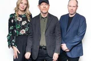 Century City, CA - November 15: Director Ron Howard, center, and members of the sound team for his film "Thirteen Lives," Rachel Tate, left, and Oliver Tarney, right, sit for portraits in a storage room inside an AMC Theatre complex in Name of Location on Tuesday, Nov. 15, 2022 in Century City, CA. (Brian van der Brug / Los Angeles Times)