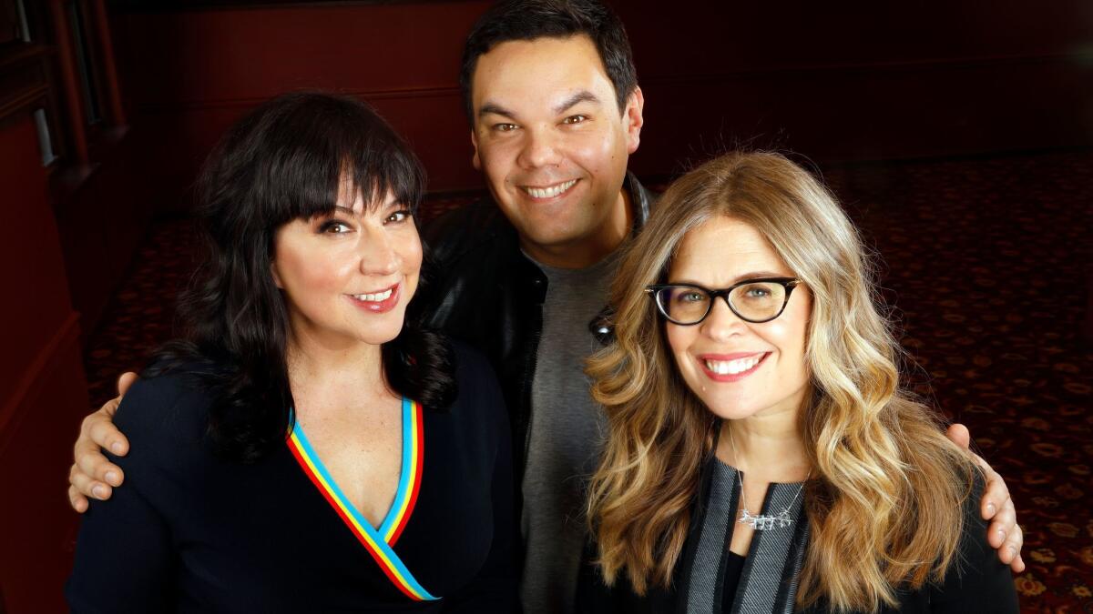 "Frozen" songwriters Kristen Anderson-Lopez, left, and Bobby Lopez, and book writer Jennifer Lee.