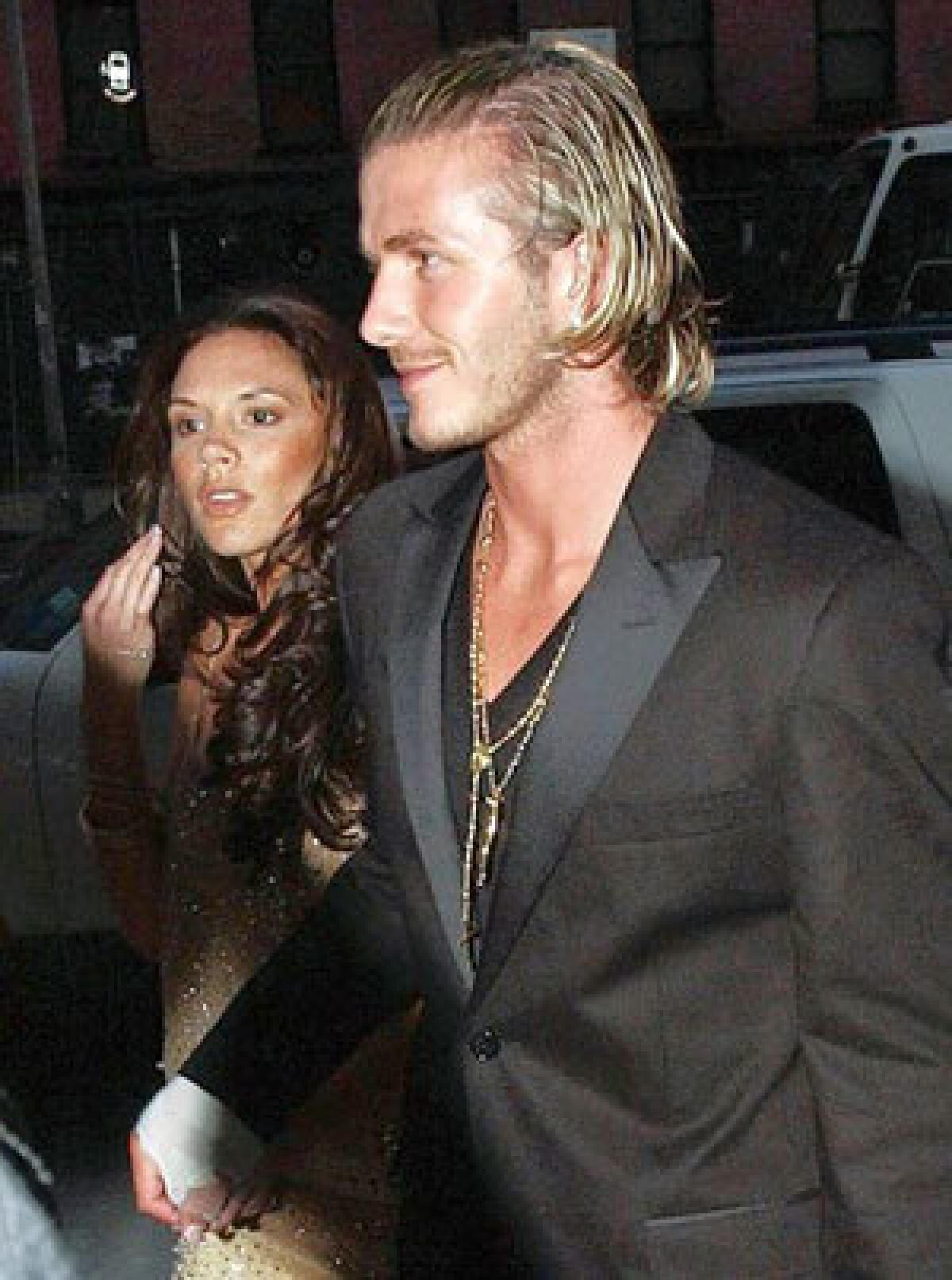 Soccer star David Beckham and wife Victoria arrive at a Vogue magazine party in 2003.