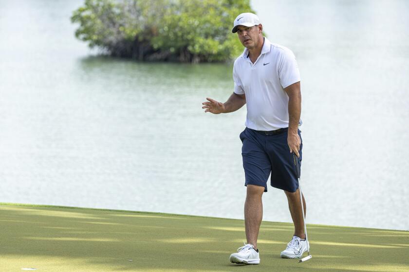 Captain Brooks Koepka, of Smash GC, reacts to his putt on the fourth green during the final round of LIV Golf Singapore at Sentosa Golf Club on Sunday, May 5, 2024, in Sentosa, Singapore. (Doug DeFelice/LIV Golf via AP)