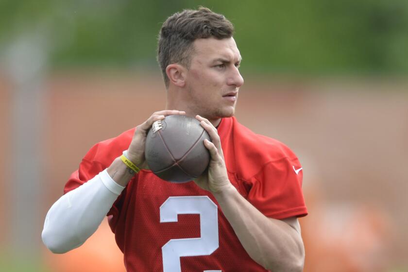 Cleveland Browns quarterback Johnny Manziel looks to pass during an organized team activity in Berea, Ohio, last Tuesday.