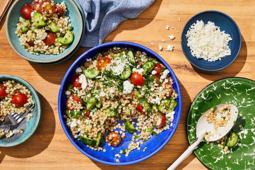 LOS ANGELES - THURSDAY, May 23, 2019: Summer Salad with Israeli Couscous. Food Stylist by Ben Mims/ Julie Giuffrida and propped by Nidia Cueva at Proplink Tabletop Studio in downtown Los Angeles on Thursday, May 23, 2019. (Leslie Grow / For the Times)