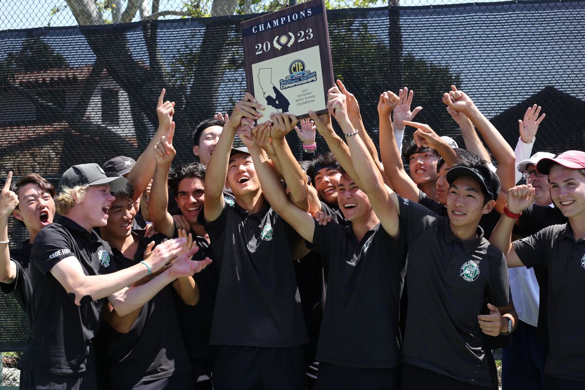 The Sage Hill School boys' tennis team holds up the CIF championship plaque Friday afternoon.