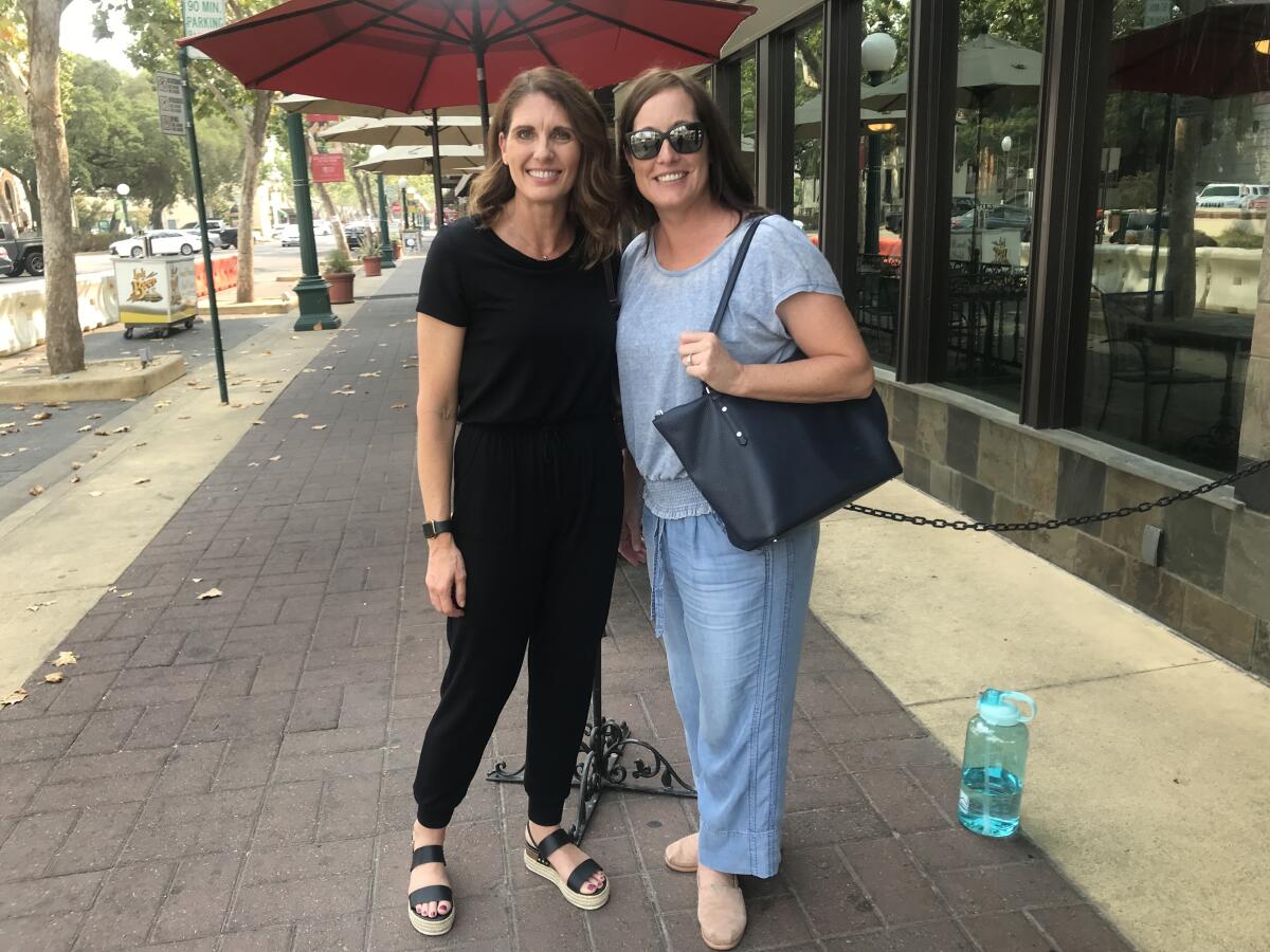 Tami Stone and Elizabeth Perkins leave a birthday lunch for Stone in downtown Lodi.