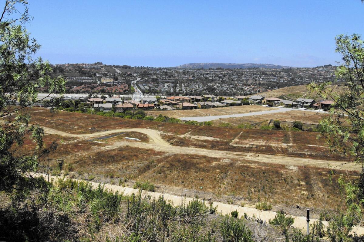 Only 98 of the 416 planned homes have been built at the stalled Pacifica San Juan housing development in San Juan Capistrano.