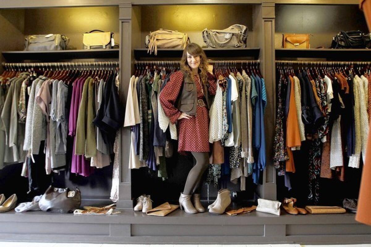 Camille De Soto, owner of Lady boutique in Eagle Rock, displays her shop's collection in closets.