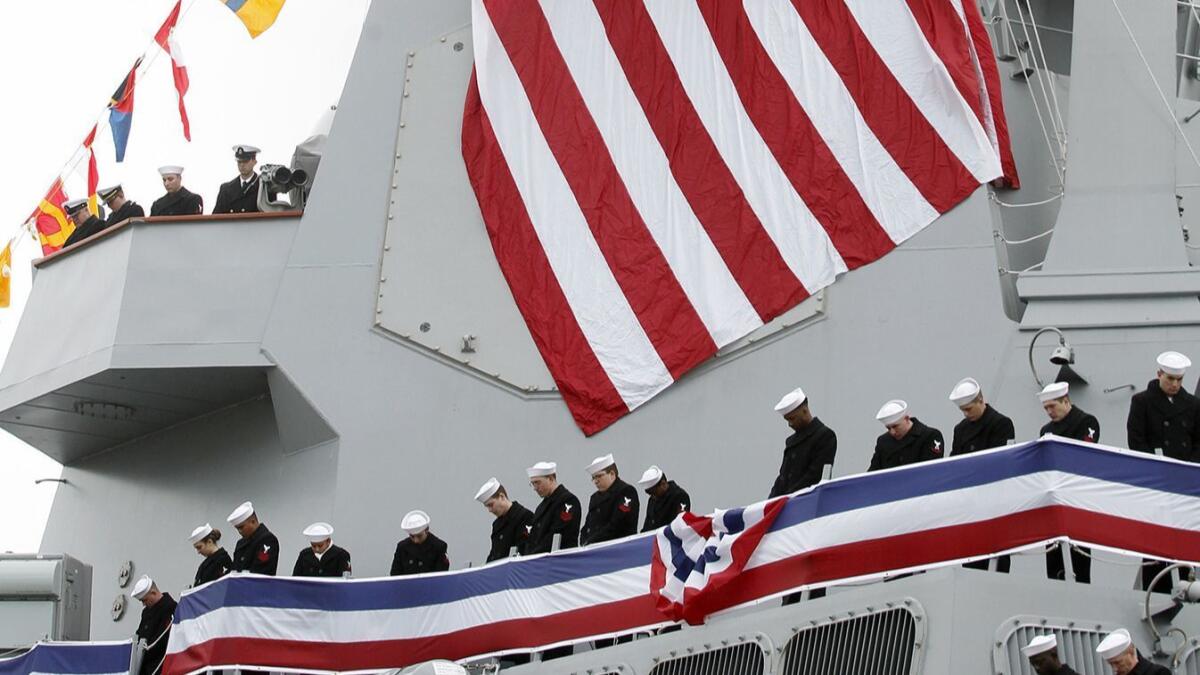 Crew members of the Thomas Hudner during an invocation after Saturday's commissioning ceremony in Boston.