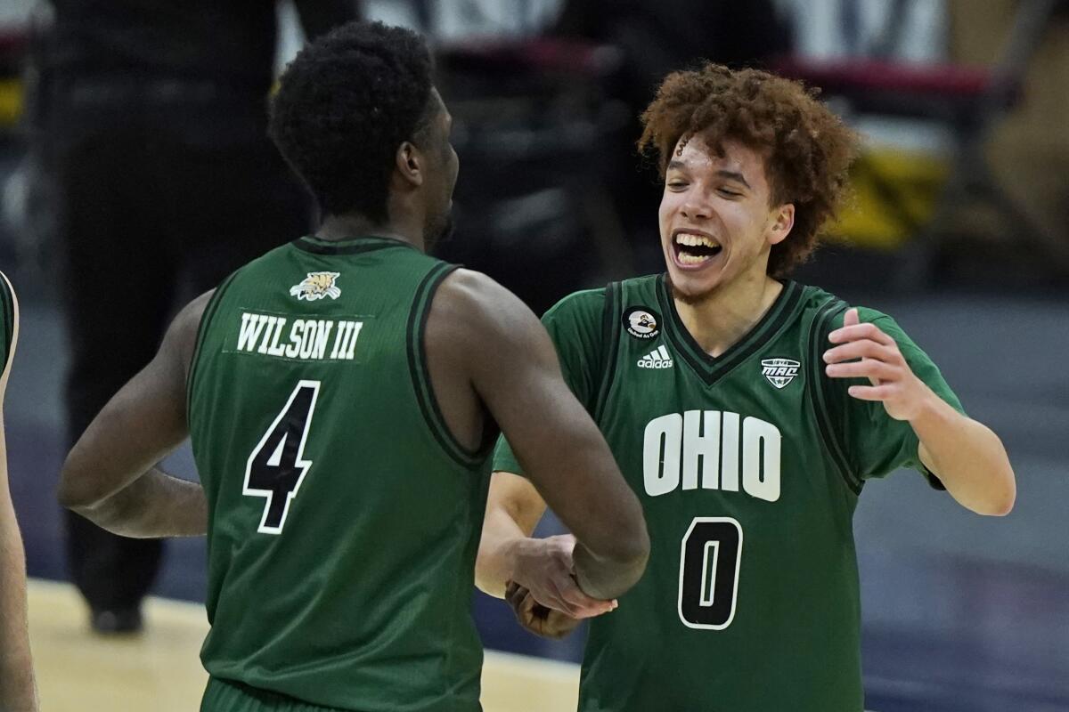 Ohio's Jason Preston and Dwight Wilson III celebrate.