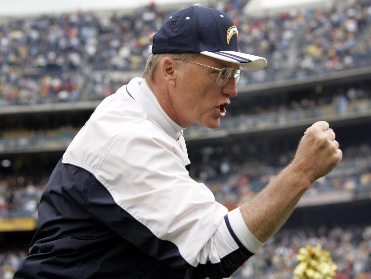 Chargers coach Marty Schottenheimer cheers on players before a game on Sunday, Jan. 2, 2005 in San Diego.