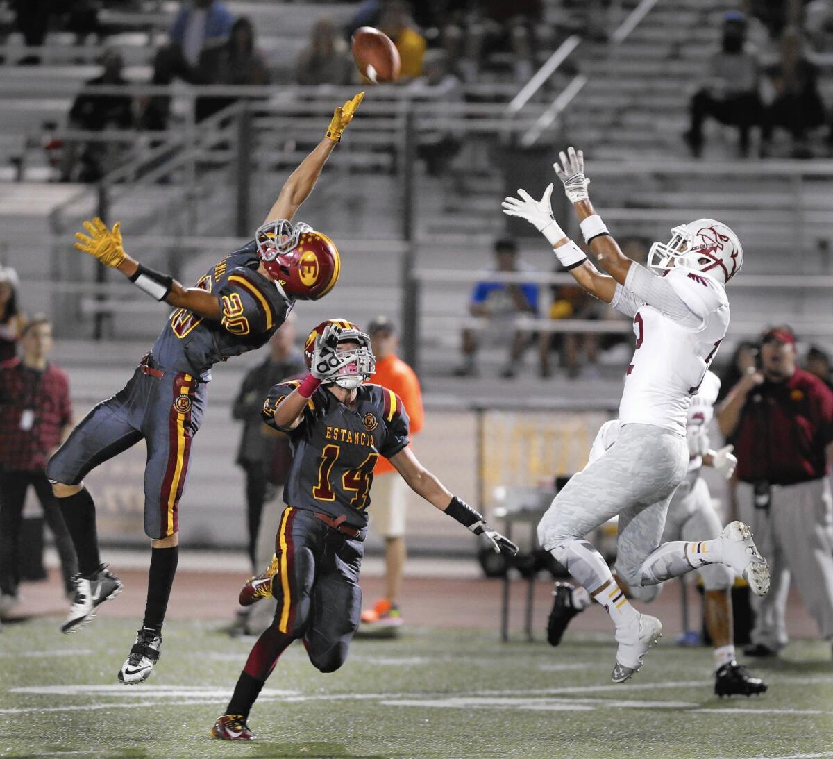 Estancia High's Konrad O'Daly, left, breaks up a pass intended for Ocean View's Dylan Durham.