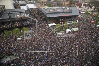 Fans gather in the Deer District for Game 6 of the NBA Finals between the Milwaukee Bucks and the Phoenix Suns at Fiserv Forum on Tuesday, July 20, 2021, in Milwaukee. (Angela Peterson/Milwaukee Journal-Sentinel via AP)