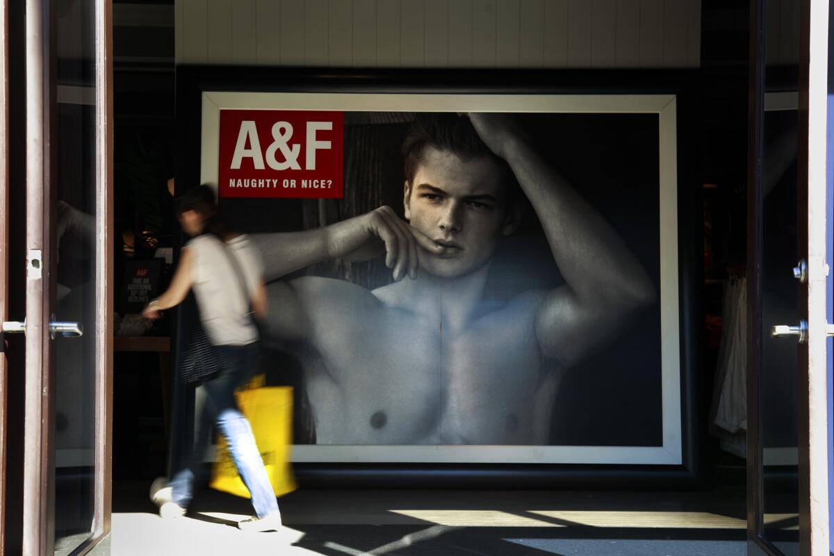Mike Jeffries, longtime CEO of Abercrombie & Fitch, is stepping down. Above, a shopper walks into an Abercrombie store in Santa Monica.