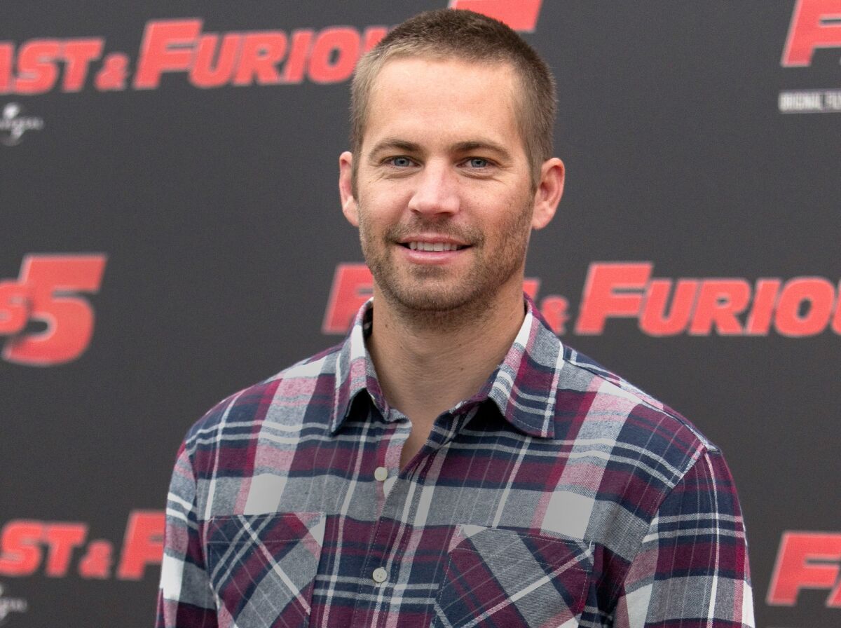 Paul Walker, shown at a promotional appearance for "Fast and Furious 5" in Rome in 2011, died in a fiery car crash in Santa Clarita two years ago.