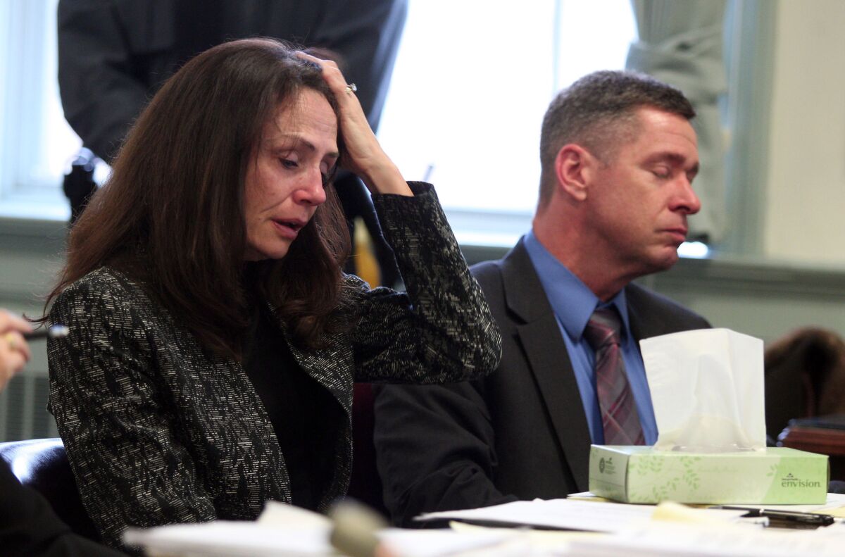 Elizabeth and Sean Canning listen to testimony in Morris County Superior Court in Morristown, N.J., on Tuesday. Their daughter Rachel, 18, is suing them for financial support after she claims they threw her out of the house.