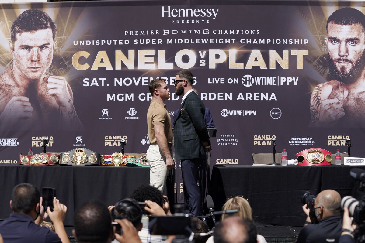 Canelo Álvarez faces off with Caleb Plant during a news conference on Sept. 21 in Beverly Hills