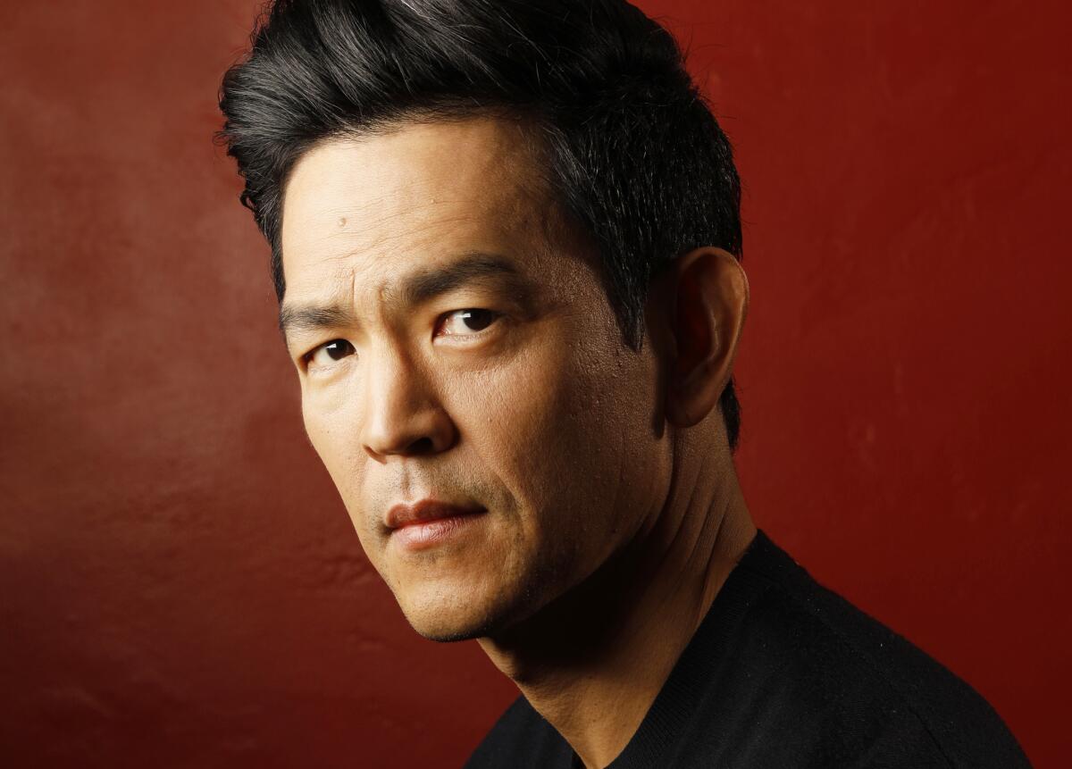 “I saw it as a story about two people grieving for the same person in different ways,” says John Cho of his film "Searching," in which he plays a father whose teen daughter goes missing after his wife dies.