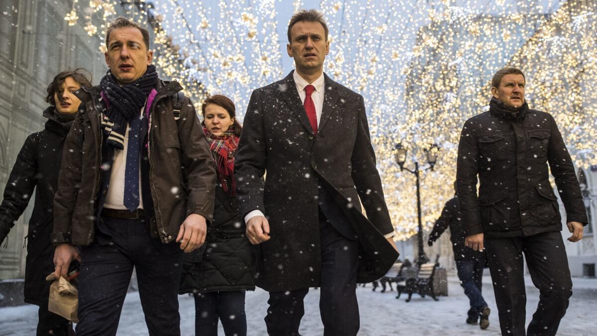 A handout picture provided by Alexei Navalny's campaign shows the Russian opposition leader, center, in Moscow on Monday.