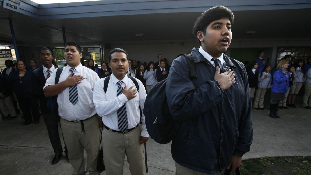 Students at the Gompers Preparatory Academy charter school in Chollas View recite the pledge of allegiance on Feb. 7, 2013.